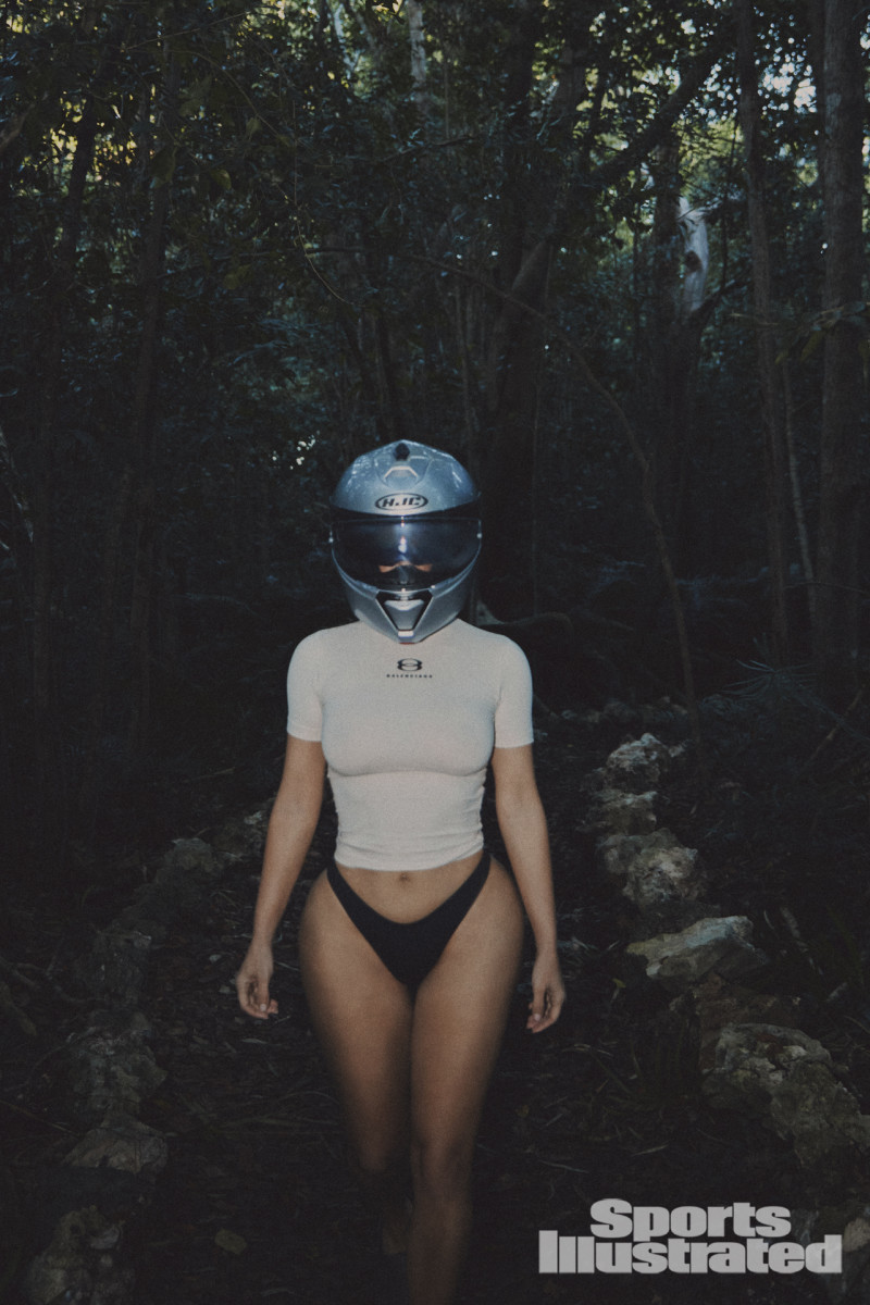 Kim Kardashian was photographed by Greg Swales in the Dominican Republic. Swimsuit by SKIMS. Top by Balenciaga. Helmet by HJC.